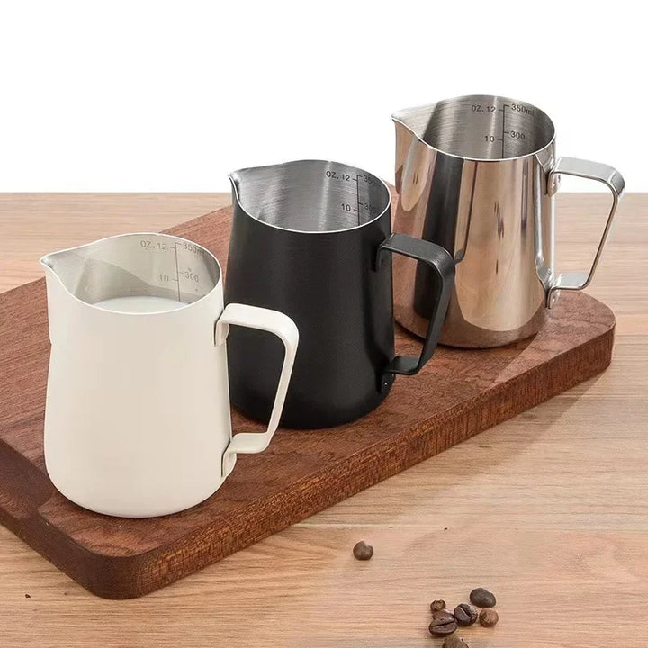 Schiuma milk pitchers in silver, cream and black