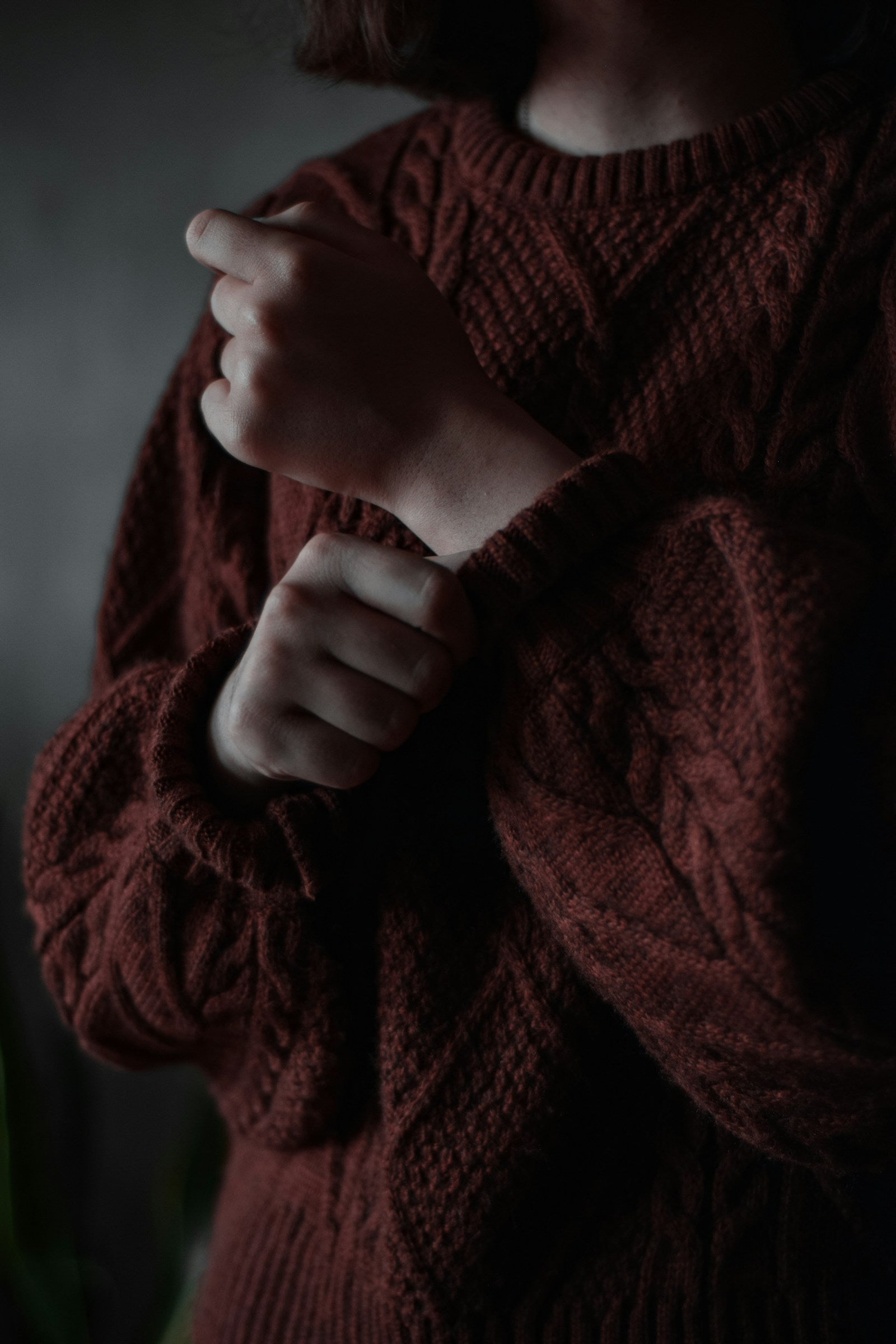 Hands holding a soft knitted wool textile