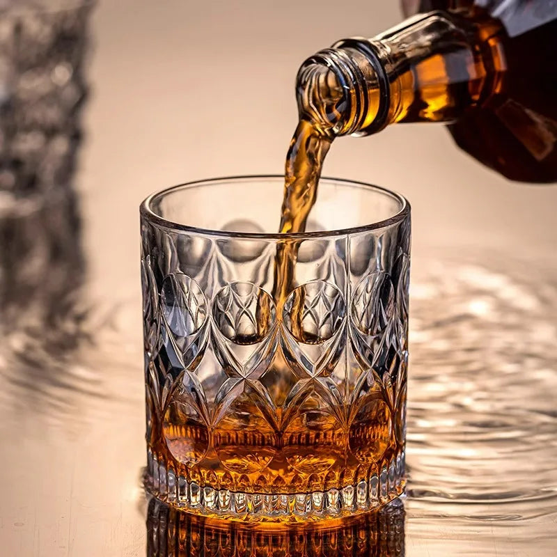 Pouring whiskey into a Barolo glass