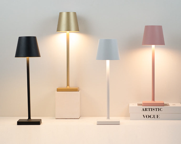 Bellagio cordless table lamps in Black, Gold and White on a shelf