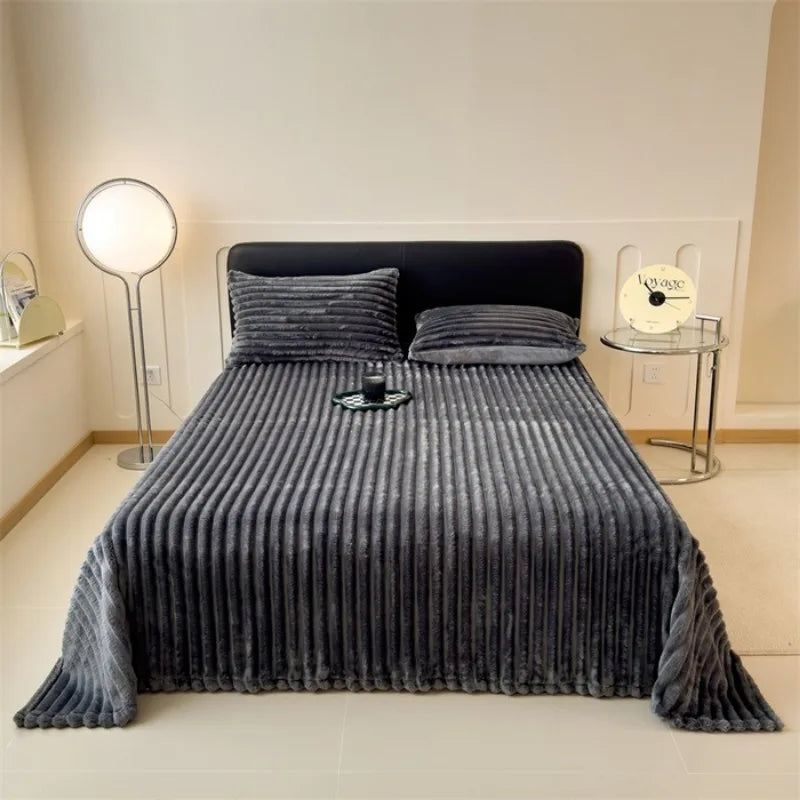 Cortina faux fur throw styled on a bed