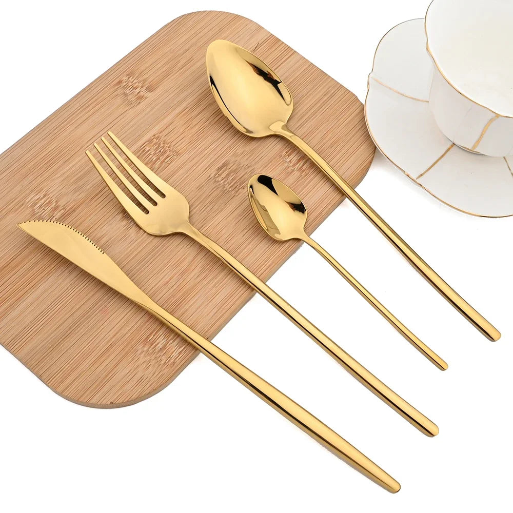 Firenze gold cutlery on a wooden board