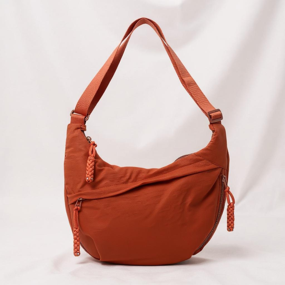 Luna Crescent Bag front zip pocket detail