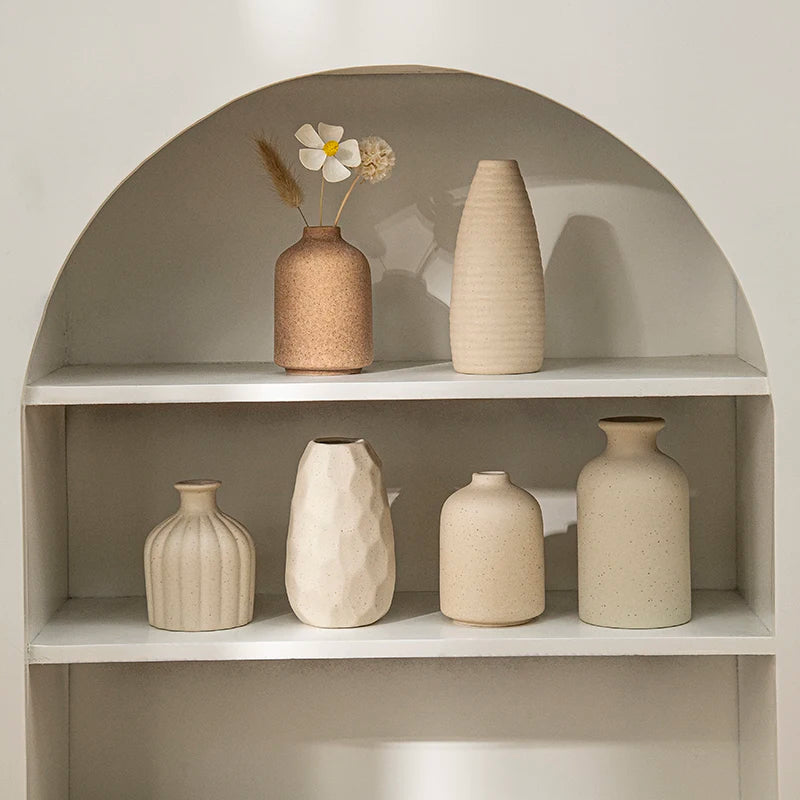 Ceramic vases styled on a shelf