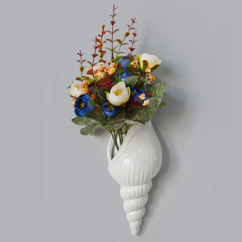 Nautilo shell vase with a bouquet