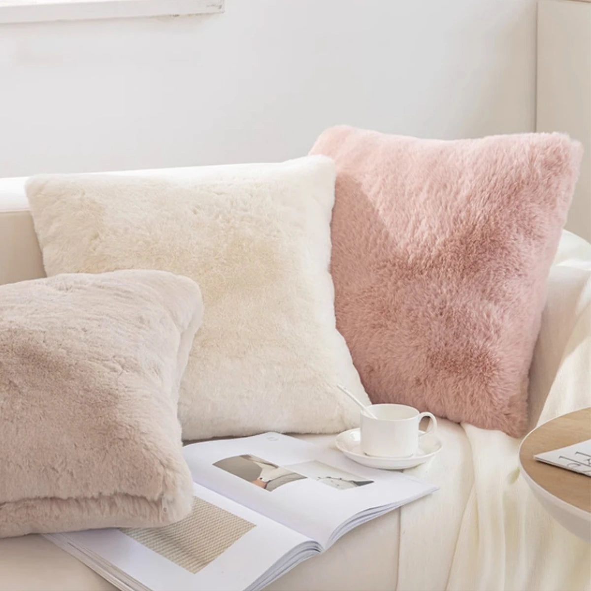 Neve faux fur cushions on a bed