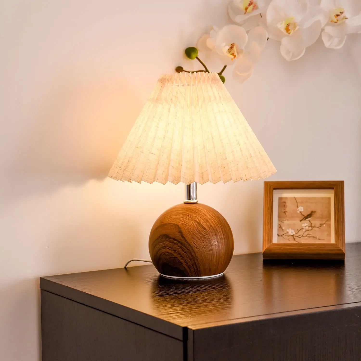 Noce pleated lamp on a nightstand