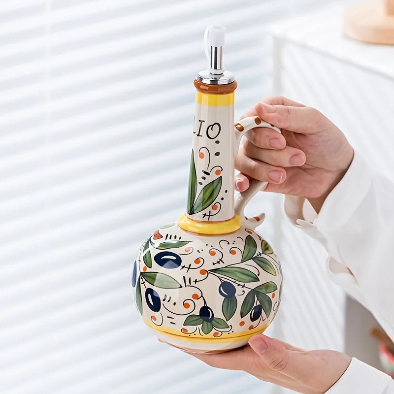 Oliera oil bottle in hand