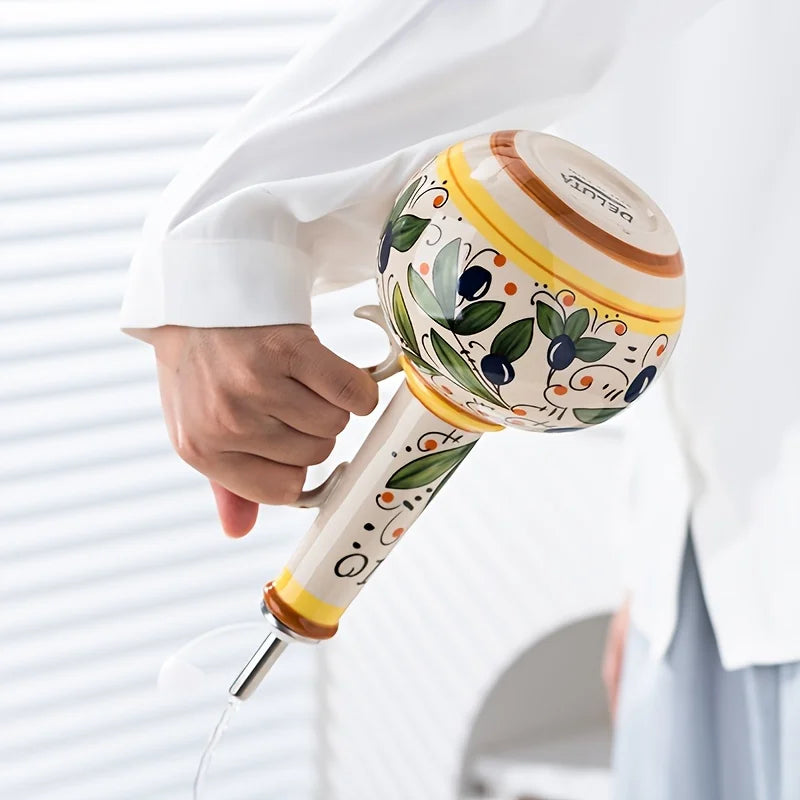Pouring from the Oliera bottle