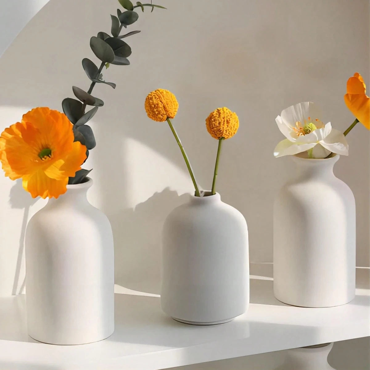 Pienza vases with orange flowers