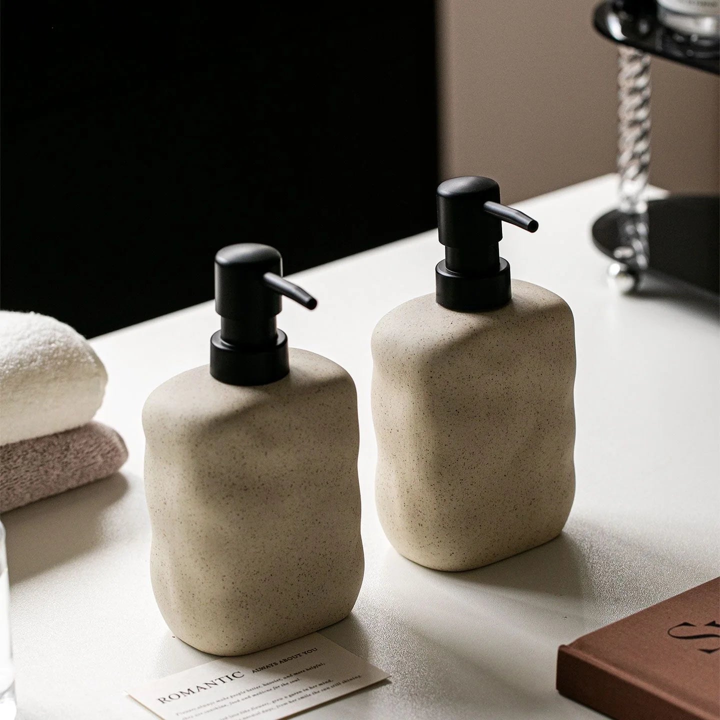 Pietra ceramic dispensers on a vanity