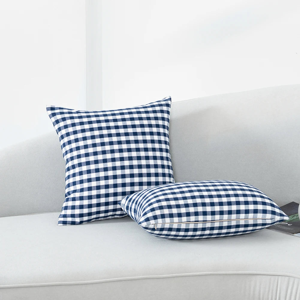 Quadretto navy gingham cushions on a white sofa