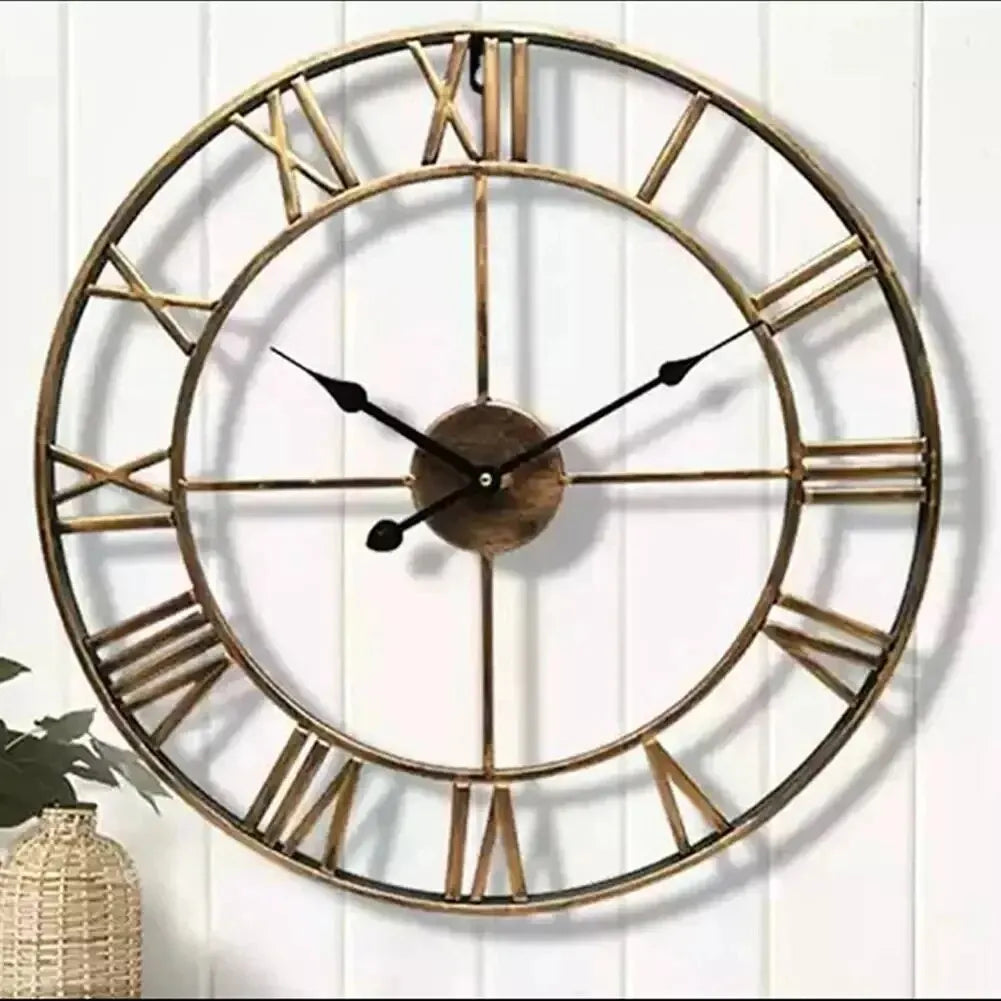 Roma gold clock on a white wall
