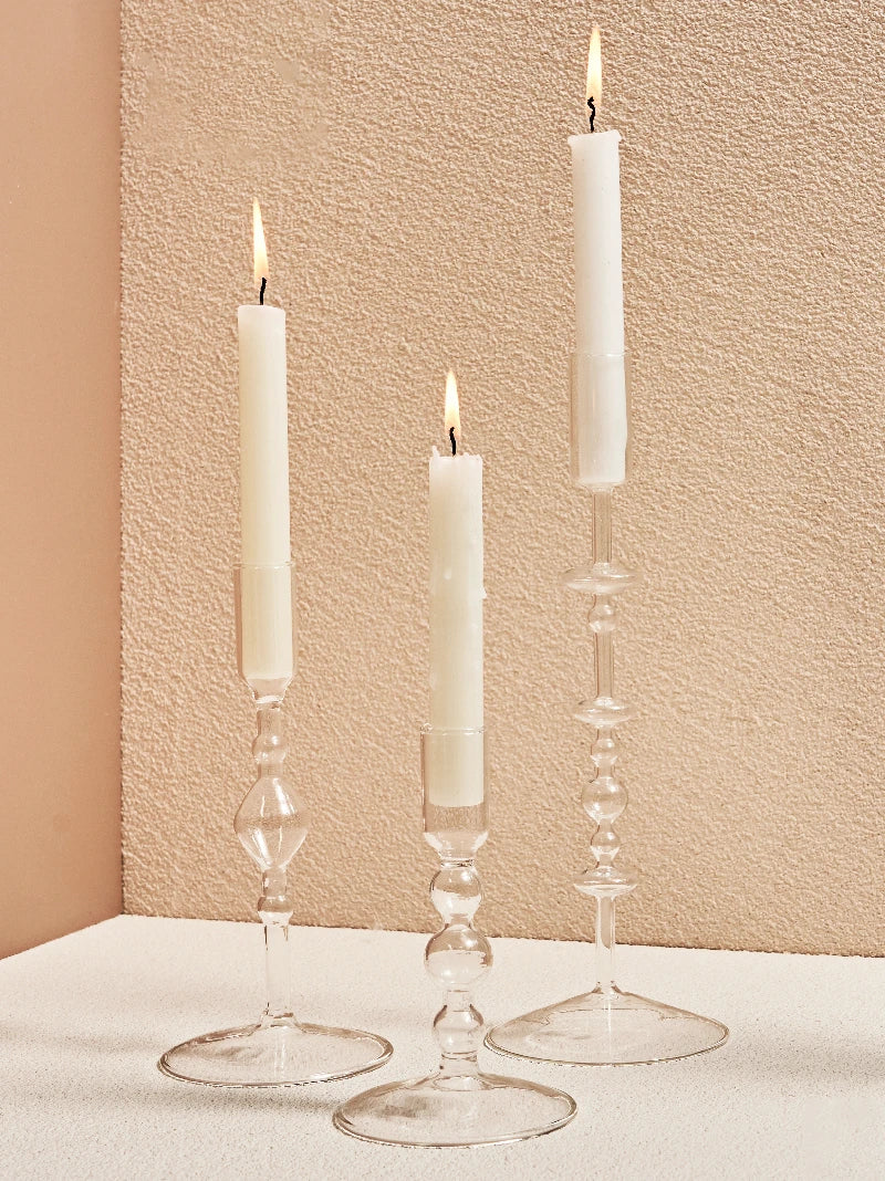 Soffio glass holders with tall tapers