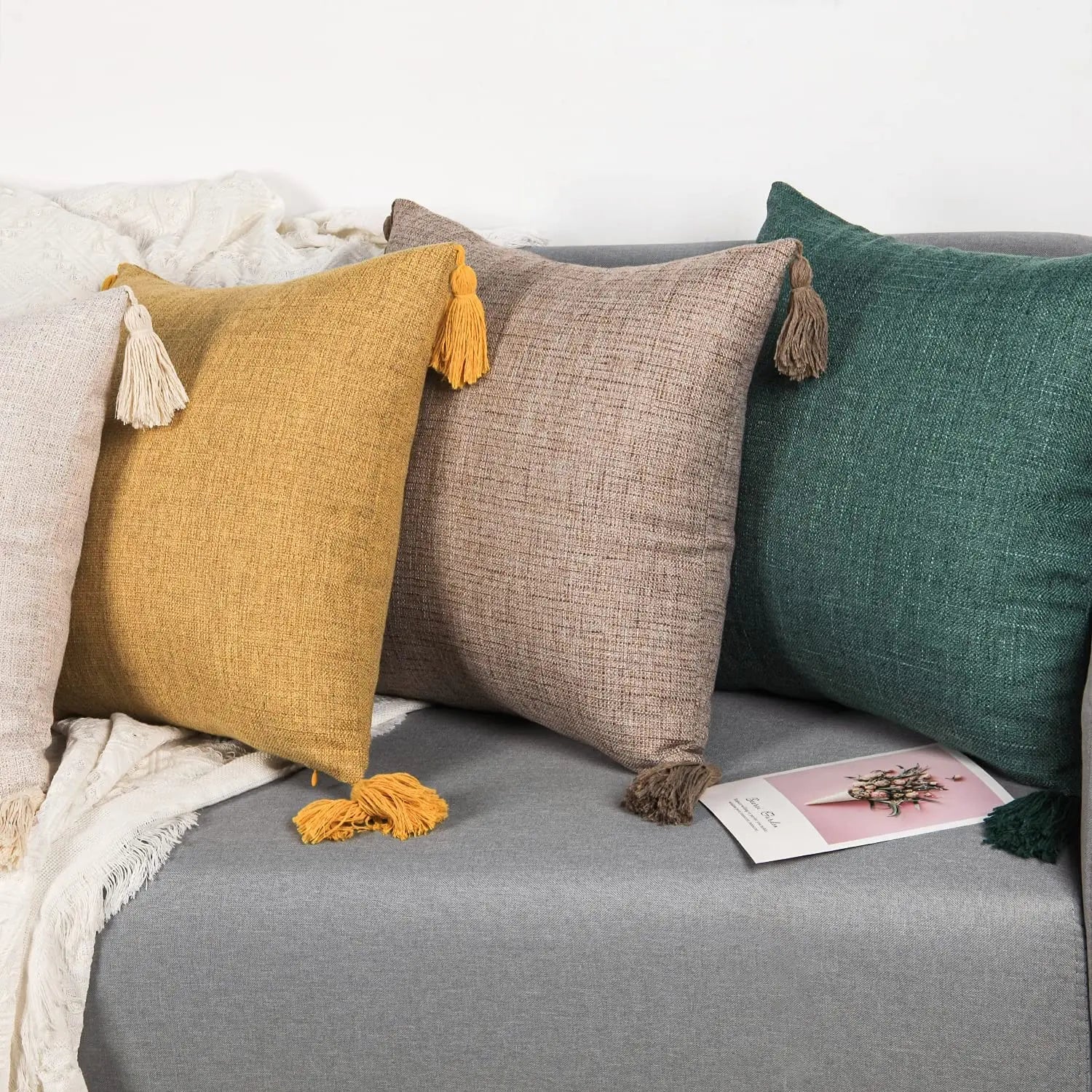 Trento tassel cushions on a grey sofa