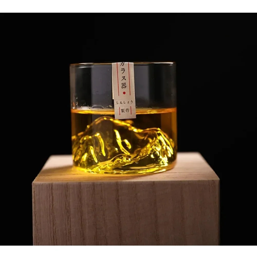 Vetta glass with whiskey on a wooden block