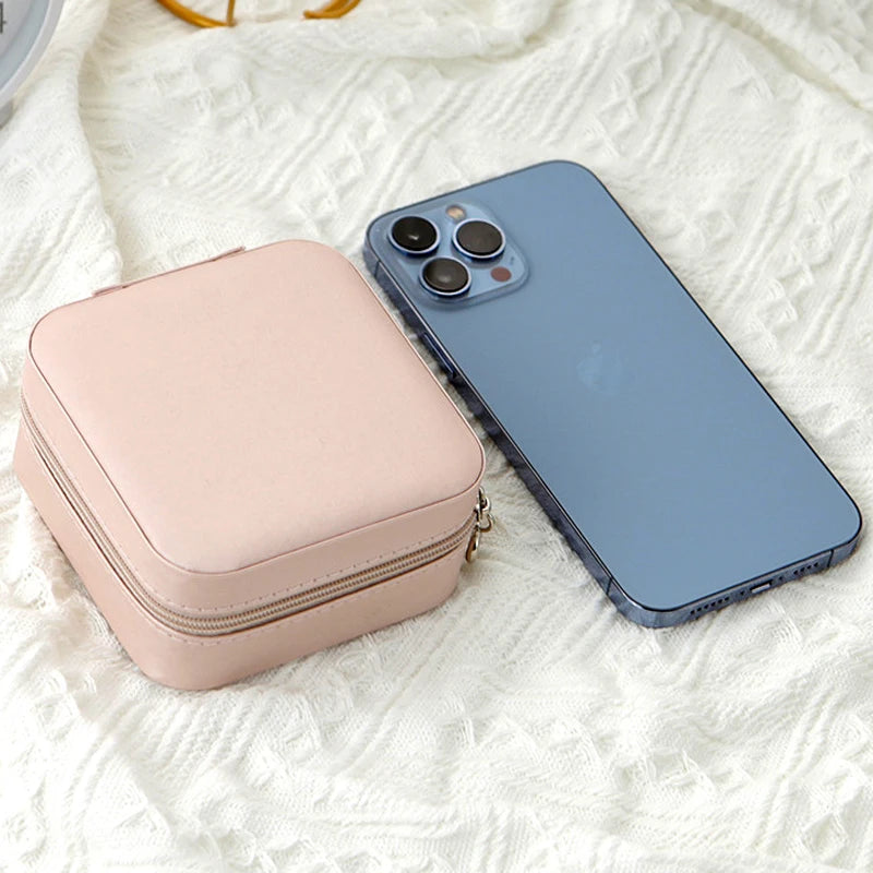 Viaggio pink jewelry box next to a phone